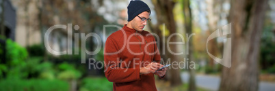 Composite image of man using mobile phone