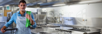 Composite image of male waiter holding tray