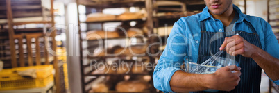 Composite image of waiter preparing food