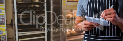 Composite image of male waiter taking order