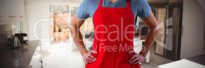 Composite image of male waiter standing with hands on hip