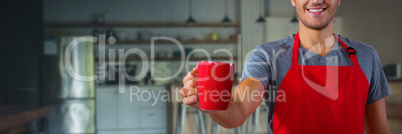 Composite image of male waiter holding coffee mug