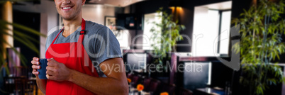 Composite image of male waiter holding coffee mug