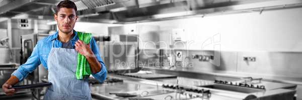 Composite image of male waiter holding tray