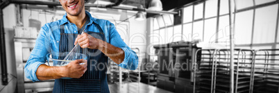 Composite image of male waiter preparing food