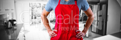 Composite image of male waiter standing with hands on hip