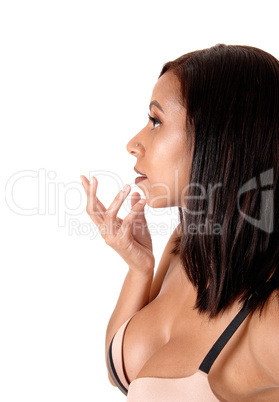 Close up image of woman in bra hand on face