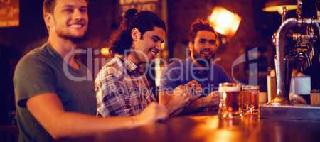 Group of male friends watching football match