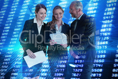 Composite image of colleagues analyzing data against white background