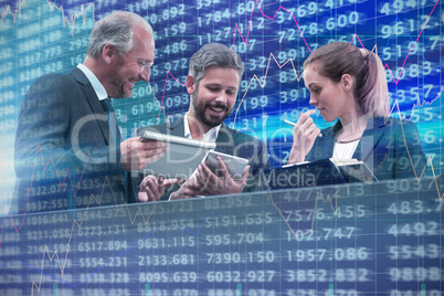Composite image of colleagues discussing  over technology against white background