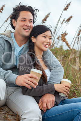 Asian Man Woman Romantic Couple Drinking Takeout Coffee on Beach