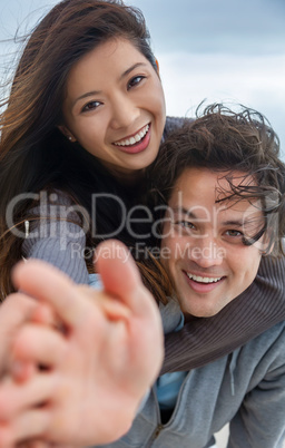 Asian Man Woman Romantic Happy Couple Piggy Back on Beach