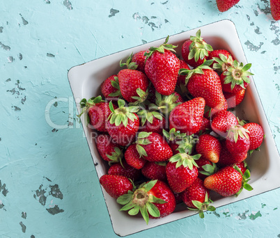 fresh ripe red strawberry in a white square plate