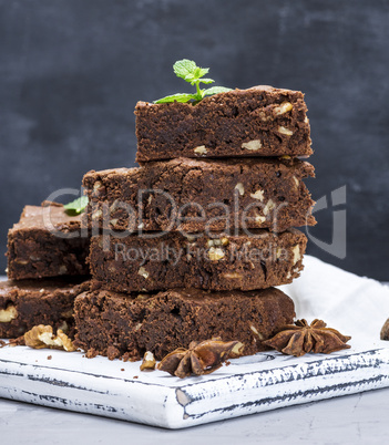 square pieces of chocolate brownie pie with walnuts