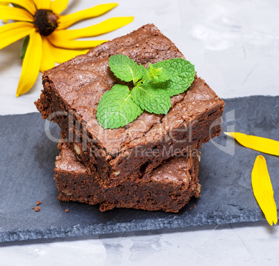 baked square pieces of chocolate pie with walnuts