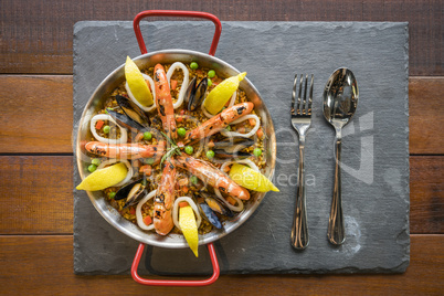 Paella with seafood vegetables and saffron served in the traditi