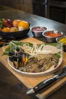 Raw seafood on plate with fruits and vegetables, healthy food, p