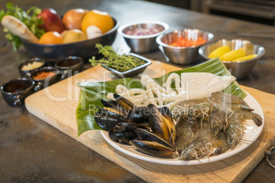 Raw seafood on plate with fruits and vegetables, healthy food, p