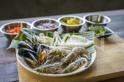 Raw seafood on plate, healthy food, prawn, clam squid