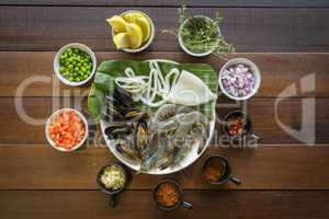 Overhead shot of Raw seafood on plate, healthy food, prawn, clam