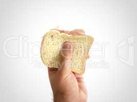 Male hand holding a baked ham sandwich