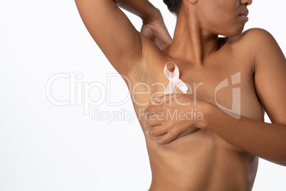 Woman for breast cancer awareness with ribbon Woman for breast cancer awareness with ribbon