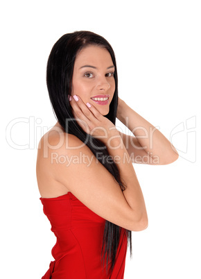 Smiling beautiful woman with hands on face