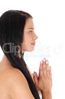 Profile of young woman praying