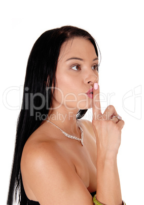 Woman holding finger over her mouth