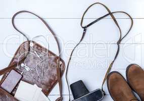 open brown leather bag, boots and vintage camera