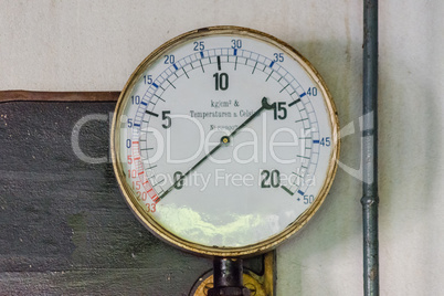 Old pressure gauges on a metal plate made of cast iron