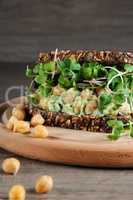 Chickpea Avocado Sandwich with radish sprouts