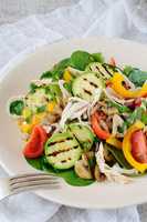 Warm chicken salad with vegetables