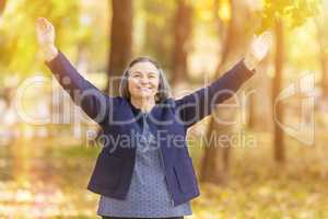 Happy woman with arms outstretched