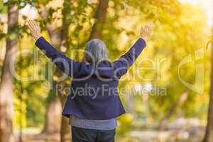 Happy woman with arms outstretched