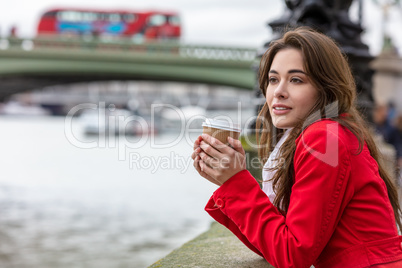Woman Drinking Coffee by Westminster Bridge, London, England
