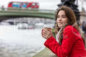 Woman Drinking Coffee by Westminster Bridge, London, England