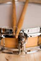 Drum sticks over a snare drum