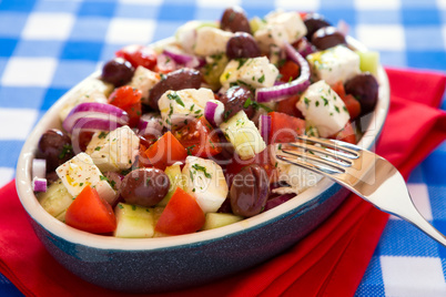 Close up of greek salad with feta cheese olives tomatoes cucumbe