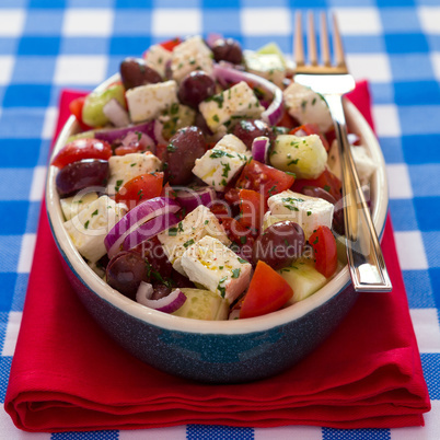 Greek salad with feta cheese olives tomatoes cucumber and onions