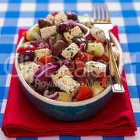 Greek salad with feta cheese olives tomatoes cucumber and onions