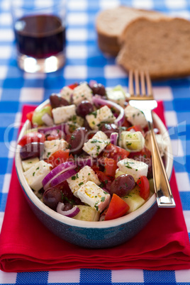 Greek salad with feta cheese olives tomatoes cucumber and onions