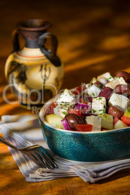 Greek salad with feta cheese tomatoes cucumber olives and onions