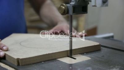 Cutting Wood in Carpenter Workshop with Table Circular Saw
