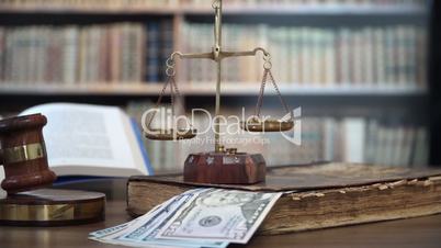 Gavel of the Judge in the Courtroom with Dollar Bills