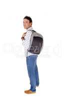 Young man standing with backpack over shoulder