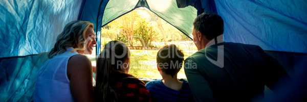 Family sitting in the tent