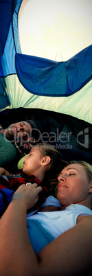 Family sleeping in the tent