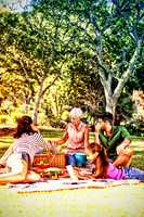 Happy family having picnic in the park