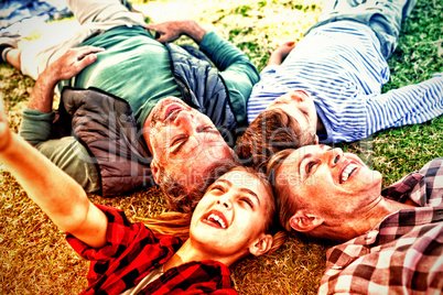 Happy family lying on the grass